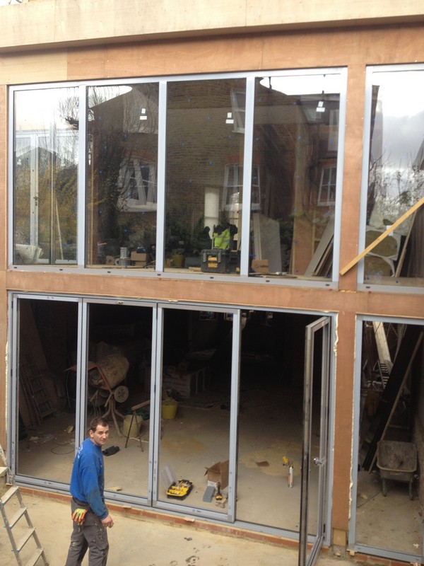 Aluminium bi-fold doors with two-storey glazing in Lambeth