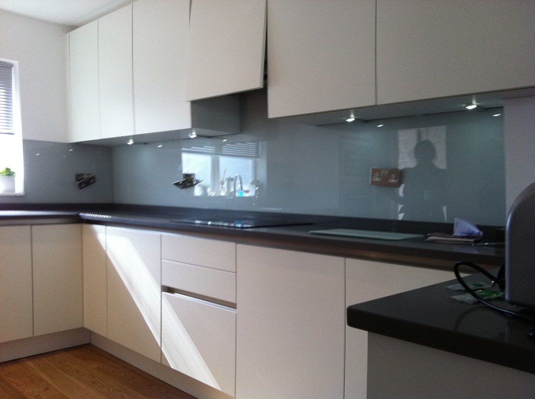 Grey glass kitchen splashback with LED lighting in Lambeth